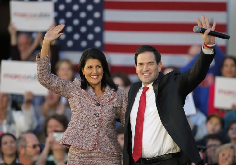 South Carolina Governor Nikki Haley and Marco Rubio react on stage during a campaign event in Chapin