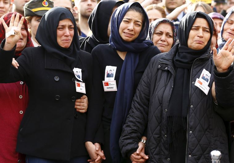 Family members of Army officer Seckin Cil, his mother Aysel (R), wife Beyza (L) and sister Busra (C)