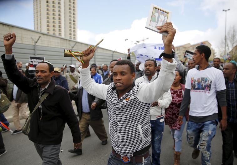 Israelis of Ethiopian descent take part in a protest in Jerusalem calling on gov't to bring the rema