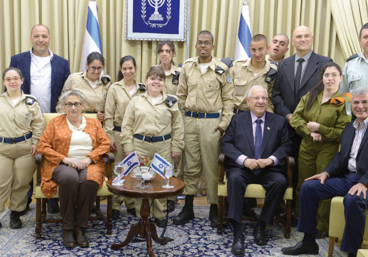PRESIDENT REUVEN RIVLIN and his wife, Nechama, host a delegation of volunteer soldiers with special 