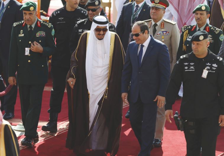 SAUDI KING Salman bin Abdulaziz, left, walks with Egypt’s President Abdel Fattah al-Sisi in Riyadh