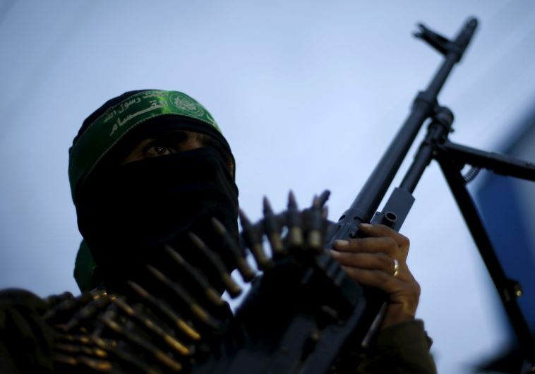 A Palestinian Hamas militant takes part in a rally