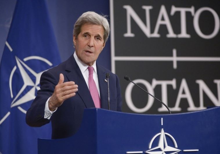 US Secretary of State John Kerry speaks to the press at NATO headquarters in Brussels