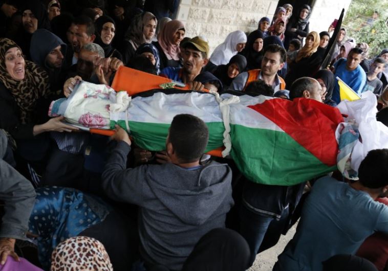 Palestinian mourners carry the bodies of Maram Abu Ismail, 23, and her brother Ibrahim Taha, 16