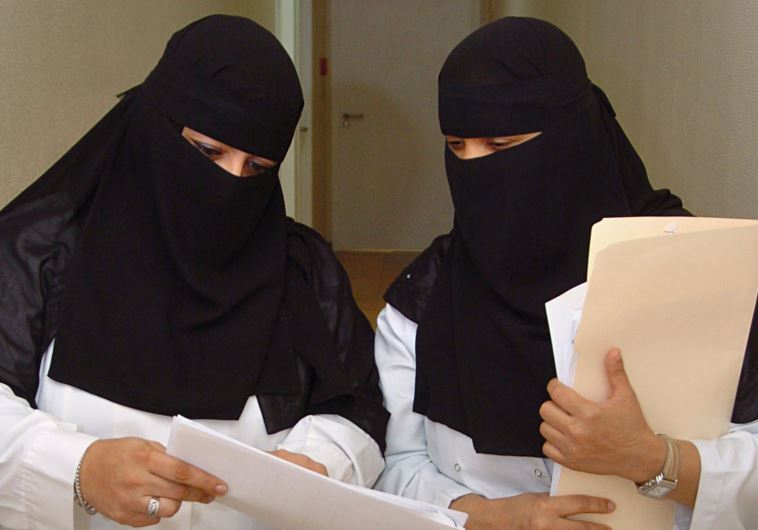 Saudi veiled women doctors work at a hospital in Riyadh