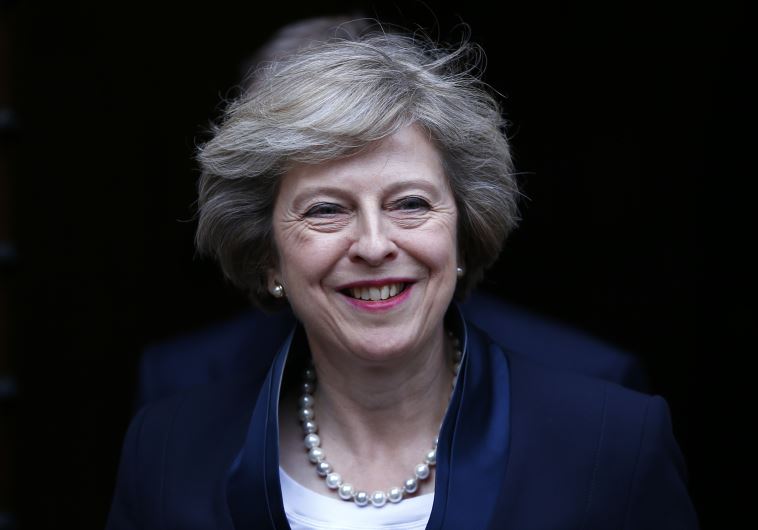 Theresa May emerges to speak to reporters after being confirmed as the leader of the Conservative Pa