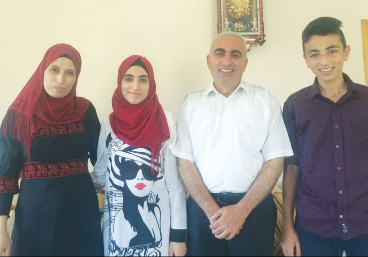 RAHAF MUFEED ABDULLAH (second left), who received the highest score on the Palestinian national stan