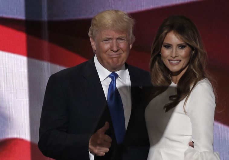 Republican US presidential candidate Donald Trump gives a thumbs up with his wife Melania.
