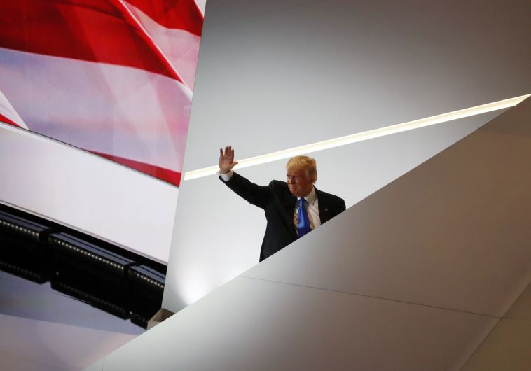 Republican U.S. presidential candidate Donald Trump waves as he leaves the stage at the Republican N