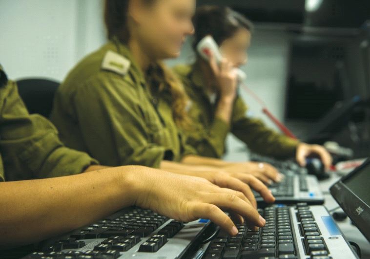 SOLDIERS AT the military’s Fire Control Center monitor enemy activity in the Gaza Strip.