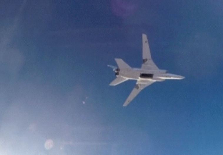 A STILL IMAGE taken from video shows a Russian Tupolev Tu-22M3 long-range bomber based in Iran flyin