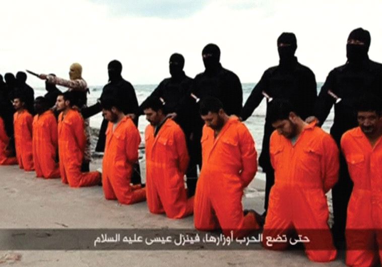 ISIS TERRORISTS pose on a Libyan beach in February 2015 with 21 captured Egyptian Christians they ar