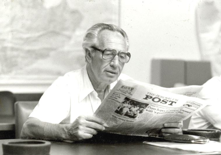 SHIMON PERES reads ‘The Jerusalem Post’ in January 1987.