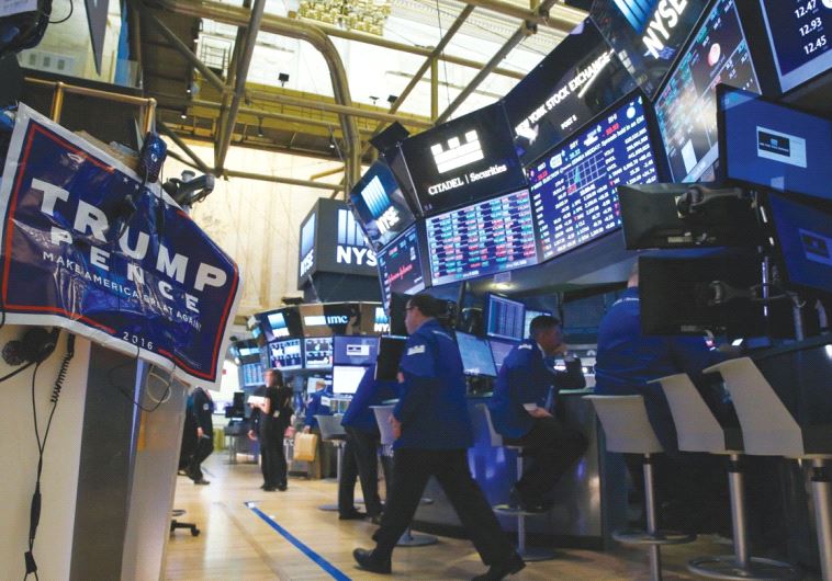 A TRUMP poster is displayed on the floor of the New York Stock Exchange