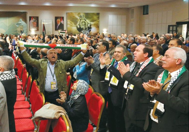 PARTICIPANTS IN the Fatah congress in Ramallah clap and cheer before a speech last week by Palestini