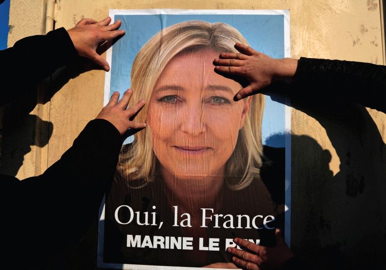SUPPORTERS OF Marine Le Pen put up a poster earlier this year. There has been a meteoric rise of rig