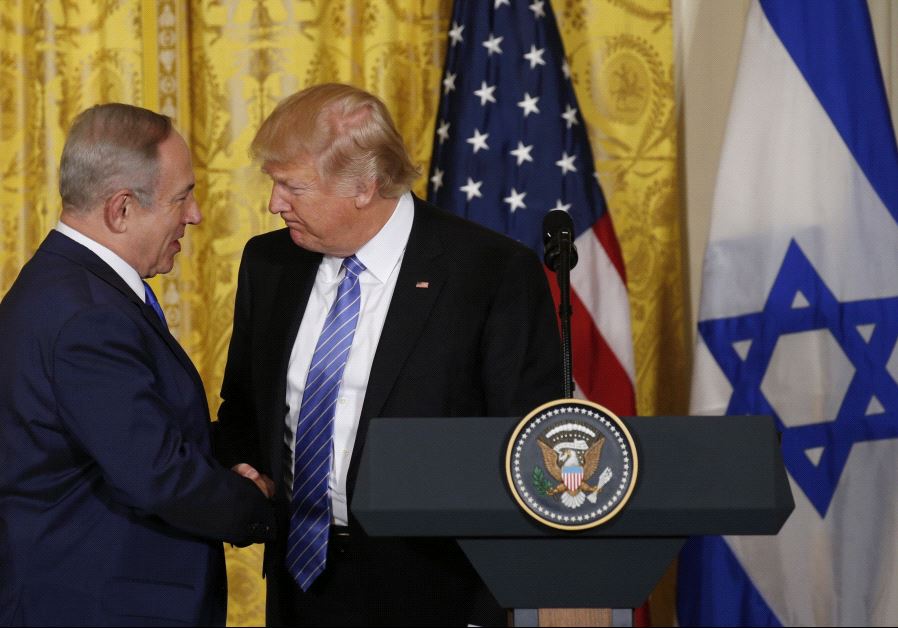 President Donald Trump (R) greets Israeli Prime Minister Benjamin Netanyahu at a joint news.