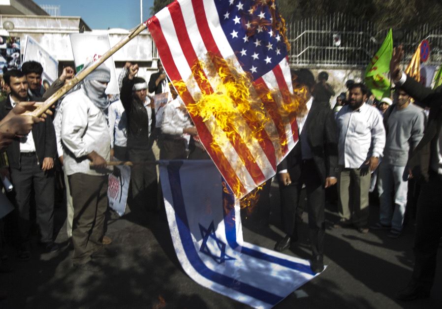 Iranian students burn a US flag.