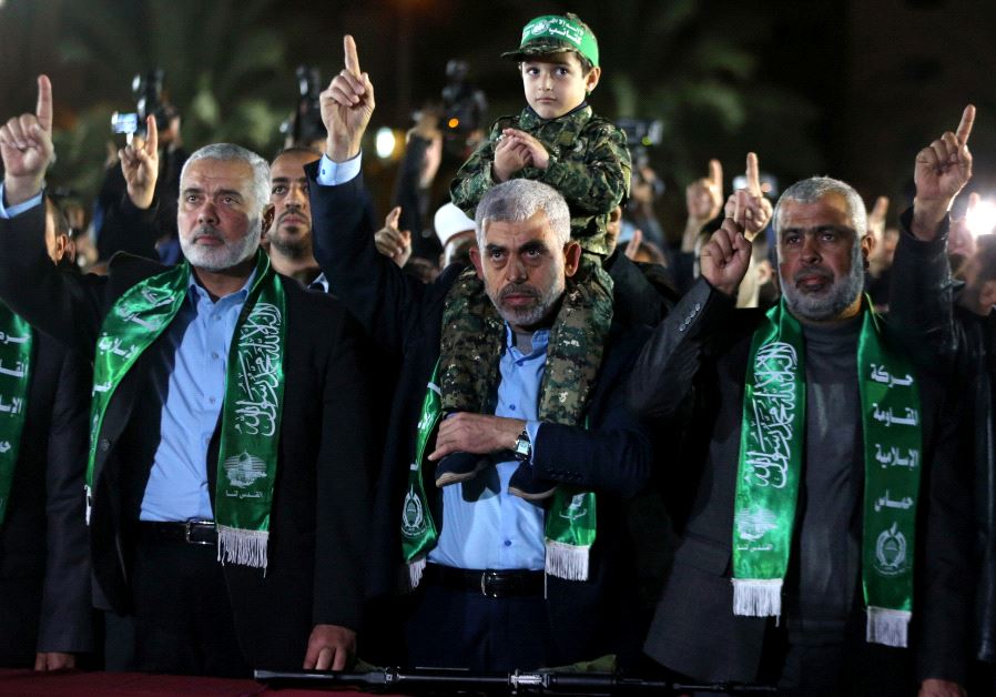 The son of senior Hamas militant Mazen Fuqaha sits on the shoulders of Hamas Gaza Chief Yehya Al-Sin