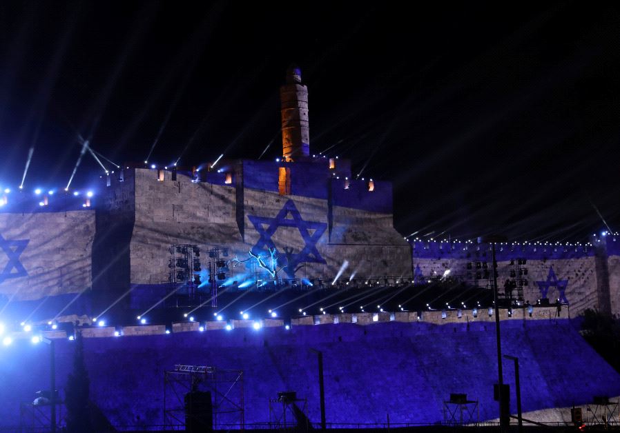 Israel national flag is projected on the wall near David Tower at the Old City of Jerusalem.