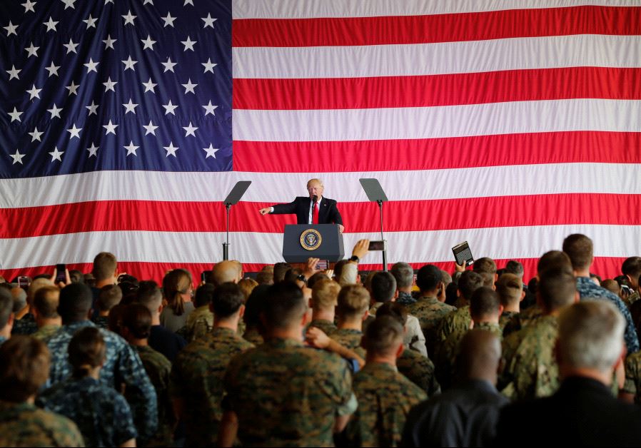 U.S. President Donald Trump delivers remarks to U.S. military personnel at Naval Air Station Sigonel