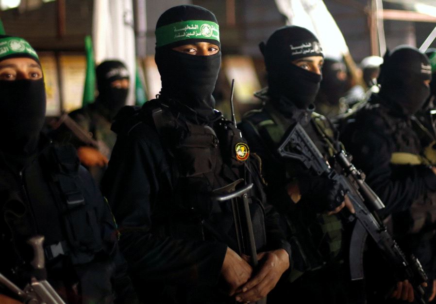 Palestinian Hamas militants take part in a memorial service for senior militant Mazen Fuqaha, in Gaz