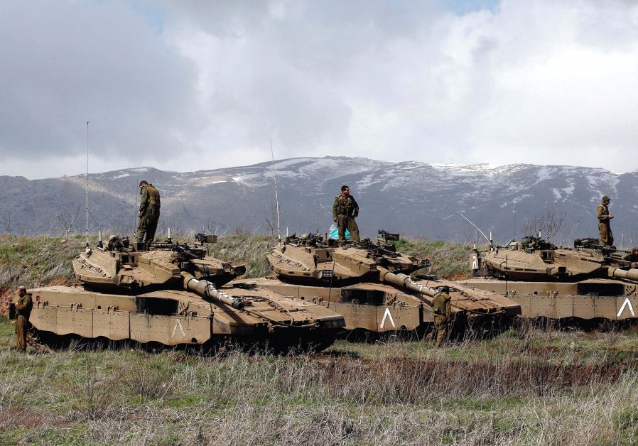 IDF tanks are seen along the Golan Heights border with Syria (Reuters)
