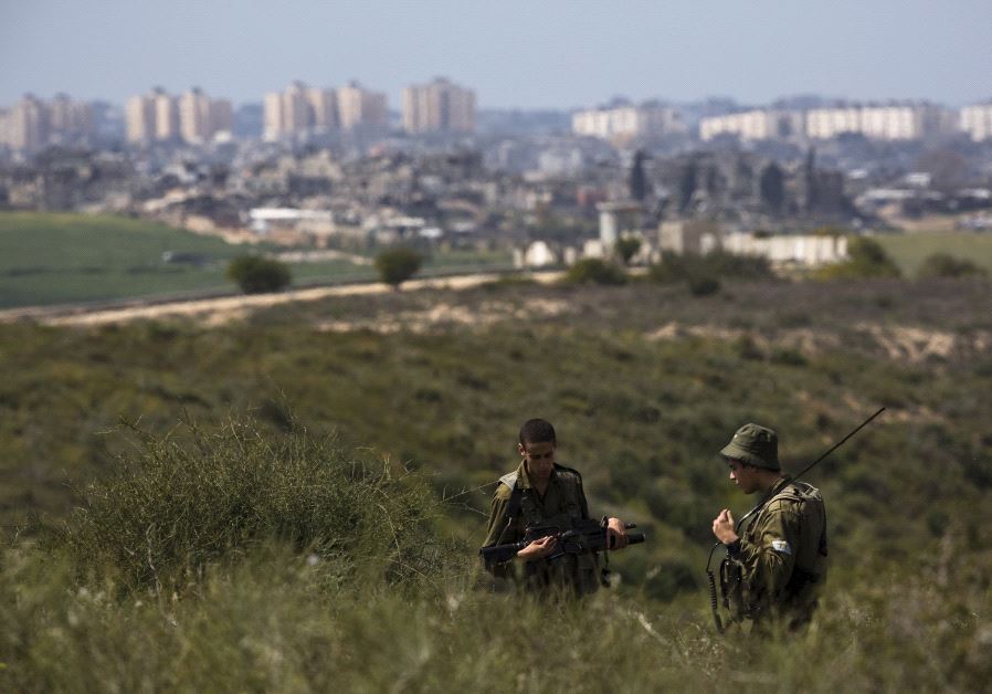IDF soldiers near Gaza border (Reuters)