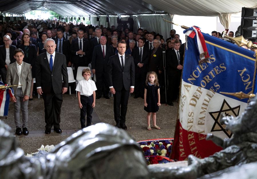 Israeli Prime Minister Benjamin Netanyahu and French President Emmanuel Macron, pay their respects after laying a wreath at the Vel d'Hiv memorial, during a ceremony commemorating the 75th anniversary of the Vel d'Hiv roundup, in Paris, France, July 16, 2017. (Reuters)