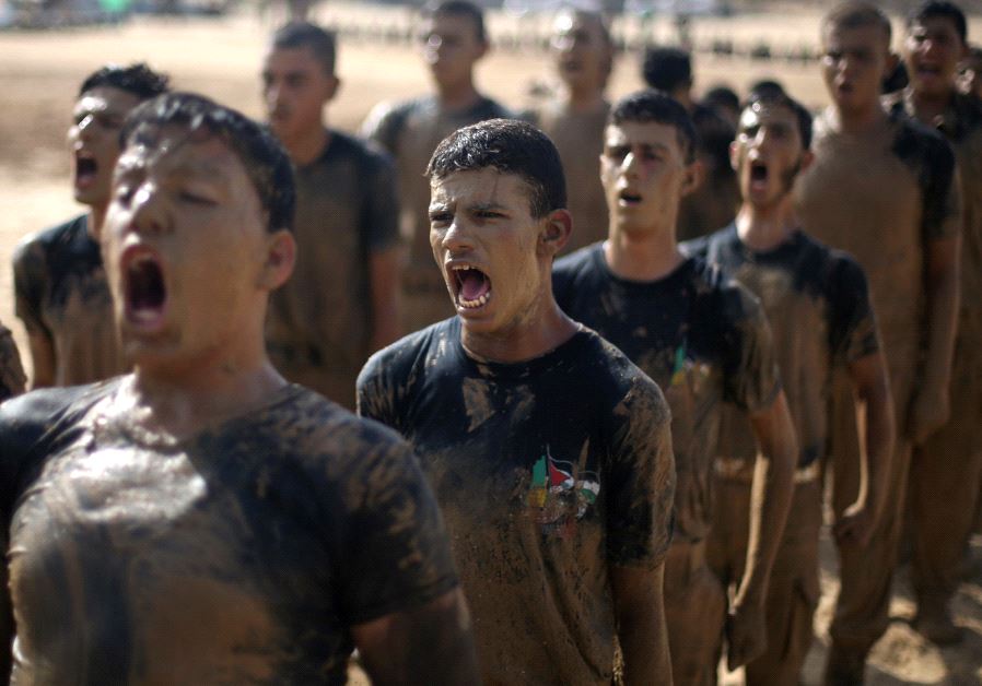 Young Palestinians take part in a military-style exercise at a Hamas summer camp in Rafah in the southern Gaza Strip July 27, 2017. (Reuters)