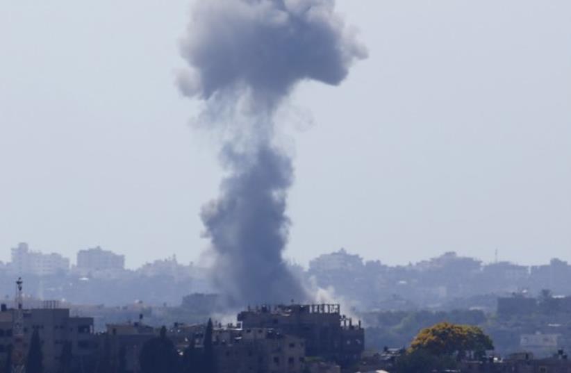 Smoke rises after an explosion in the northern Gaza Strip (photo credit: REUTERS)