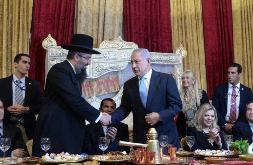 Prime Minister Benjamin Netanyahu and his wife Sara at a Mimouna celebration in Or Akiva (photo credit: KOBY GIDEON/GPO)
