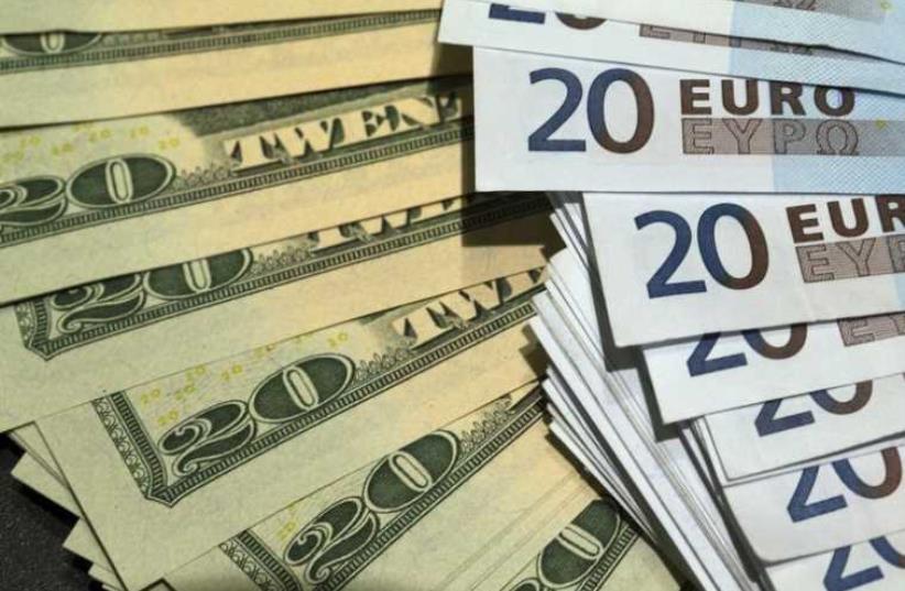US dollars and euros banknotes are seen in this illustration photo (photo credit: REUTERS)
