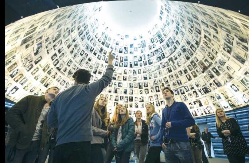 STUDENTS FROM Germany visit the Hall of Names at Yad Vashem in Jerusalem (photo credit: REUTERS)