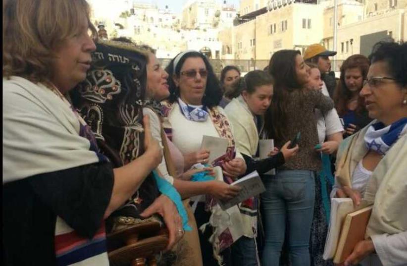 Women of the Wall carry a Torah scroll into the women's section of the Western Wall plaza (photo credit: WOMEN OF THE WALL)