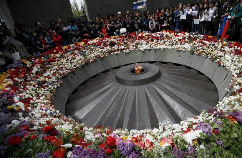 People mourn at the Tsitsernakaberd Armenian Genocide Memorial Museum in Yerevan (photo credit: REUTERS)