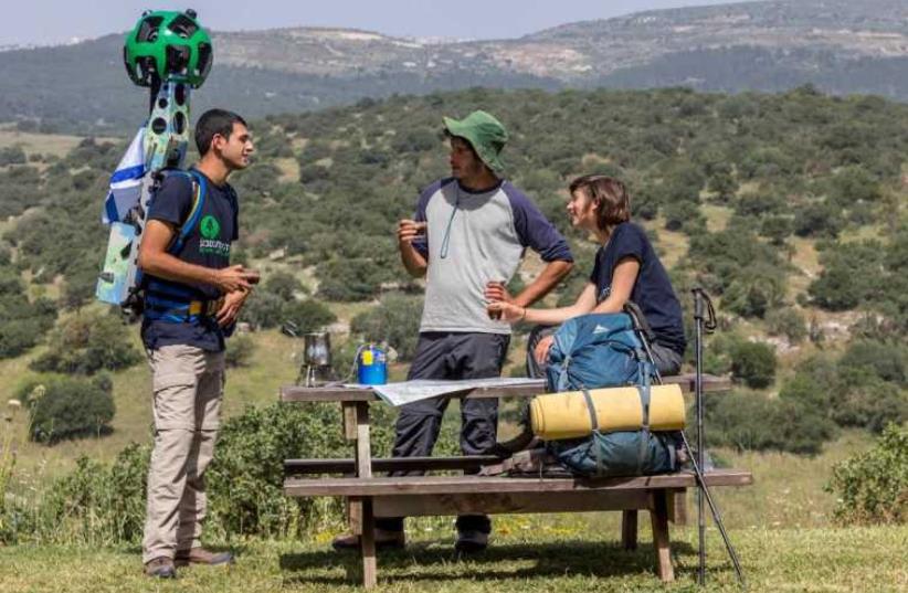 SPNI youth members on Israel's National Trail with Google Street View cameras  (photo credit: SPNI)