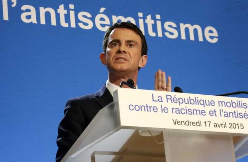 French Prime Minister Manuel Valls leaves after a speech to present a plan to fight racism and anti-Semitism at the Prefecture in Creteil near Paris April 17, 2015.  (photo credit: REUTERS)