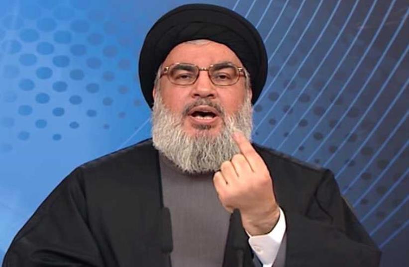 Hassan Nasrallah (photo credit: HO / AL-MANAR TV / AFP)
