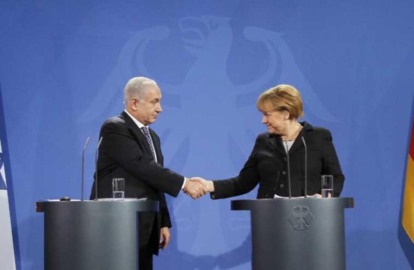 Netanyahu and Merkel (photo credit: WOLFGANG RATTAY / REUTERS)