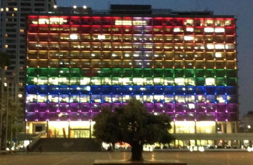 Tel Aviv Municpality building lit up in rainbow colors symbolizing LGBT pride (photo credit: NIV ELIS)