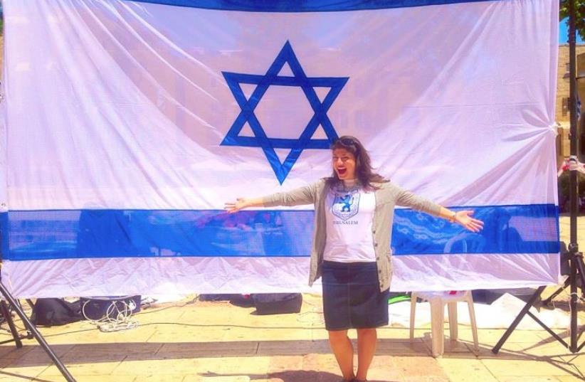 Jordana Brown with an Israeli flag (photo credit: JORDANA BROWN)