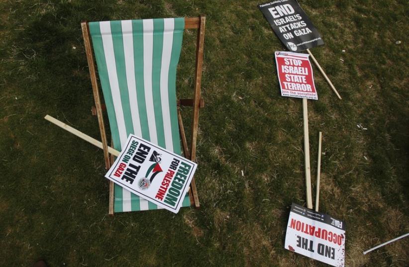 Placards are seen on the ground after a protest in support of the people of Gaza, in central London August 9, 2014.  (photo credit: REUTERS)