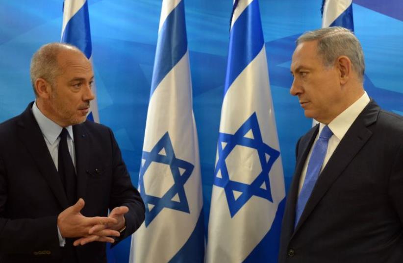 Chairman and CEO of Orange Stephane Richard and Prime Minister Benjamin Netanyahu (photo credit: CHAIM TZACH/GPO)