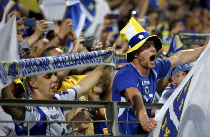 Fans of Bosnia cheer during their Euro 2016 qualifying soccer match against Israel in Bosnia and Herzegovina, June 12, 2015 (photo credit: REUTERS)