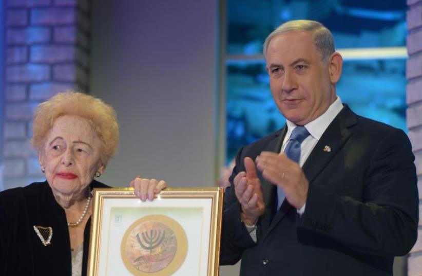 Esther Herlitz is applauded by Prime Minister Benjamin Netanyahu on receiving the Israel Prize, April 24. (photo credit: GPO)