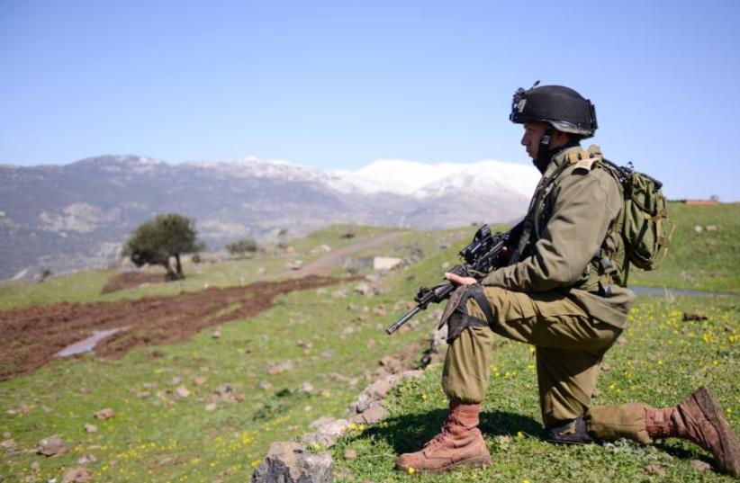 An IDF soldier takes part in drills on the Golan Heights (photo credit: IDF)