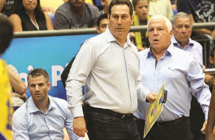 Despite having a guaranteed contract for next season, Guy Goodes (center) may have coached his final game for Maccabi Tel Aviv (photo credit: ADI AVISHAI)