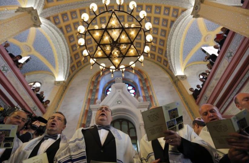 Jewish community members attend the re-opening ceremony of Great Synagogue in Edirne, western Turkey March 26, 2015. (photo credit: REUTERS)
