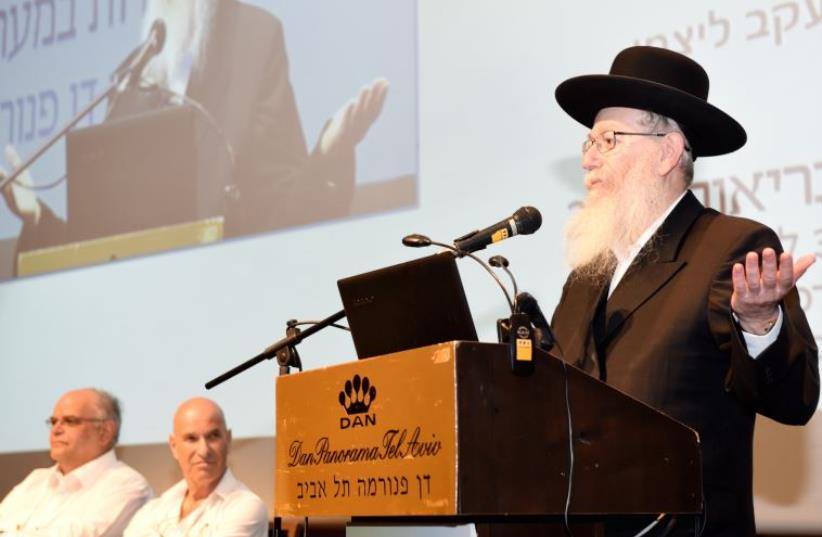 Ya'acov Litzman speaks to an audience at Tel Aviv's Dan Panorama Hotel (photo credit: Courtesy)